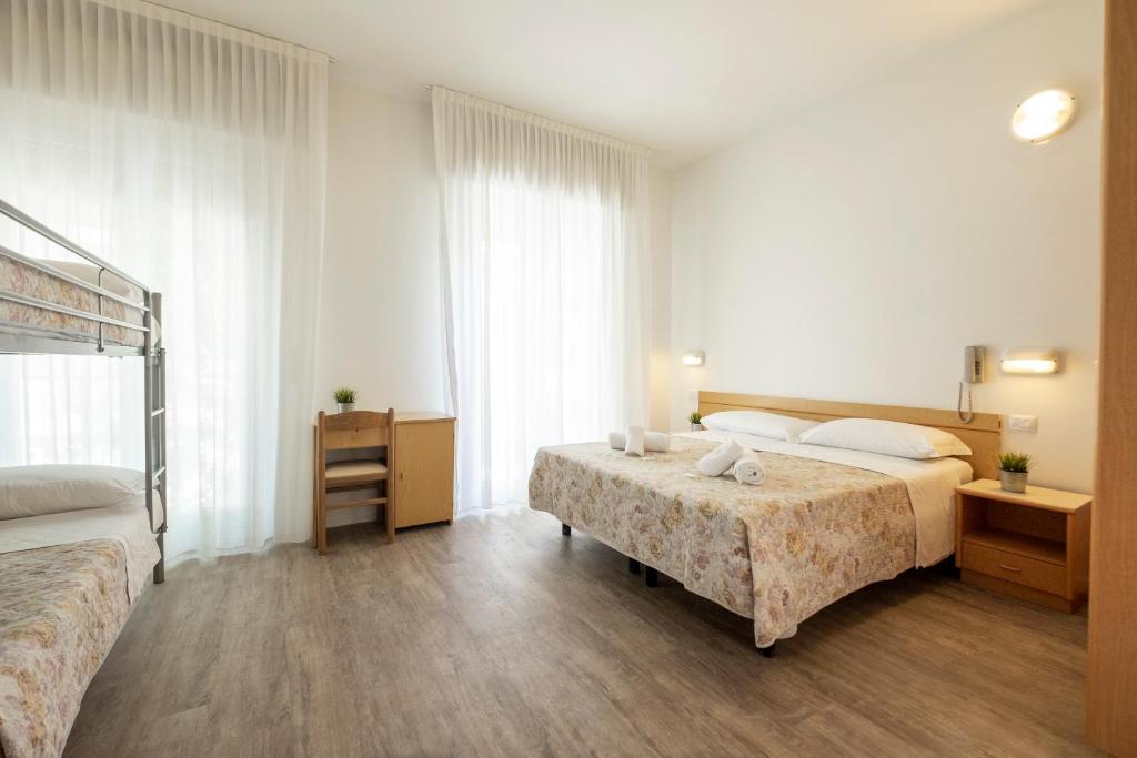 Postel nebo postele na pokoji v ubytování Hotel Lexington