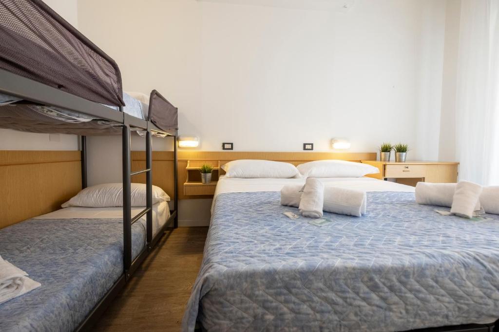 Postel nebo postele na pokoji v ubytování Hotel Lexington