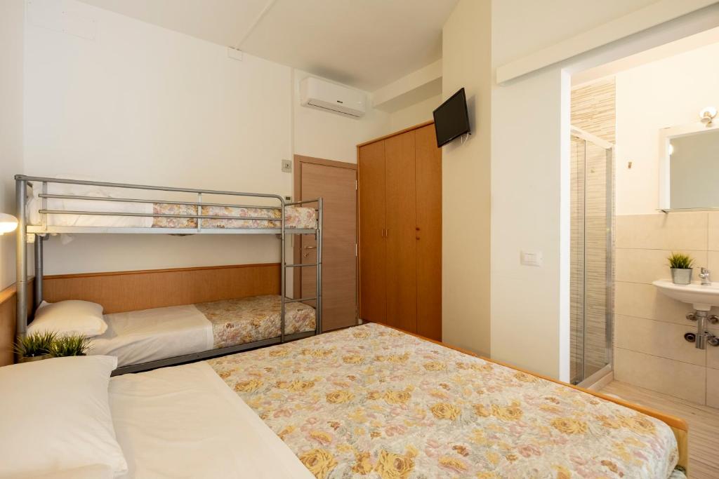Postel nebo postele na pokoji v ubytování Hotel Lexington