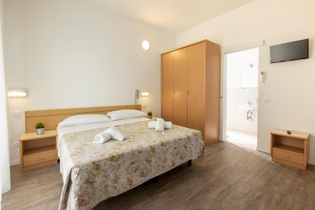 Postel nebo postele na pokoji v ubytování Hotel Lexington
