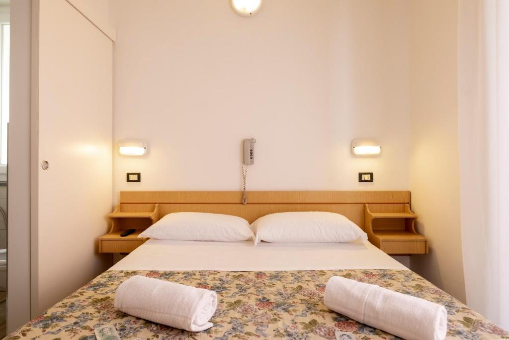 Postel nebo postele na pokoji v ubytování Hotel Lexington