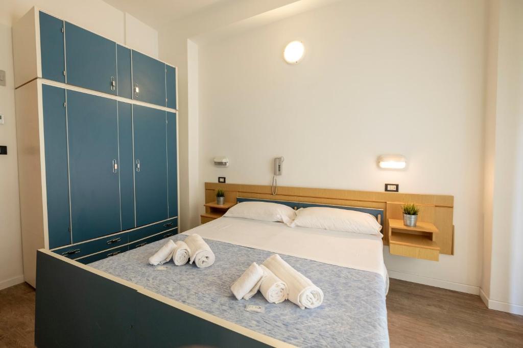 Postel nebo postele na pokoji v ubytování Hotel Lexington