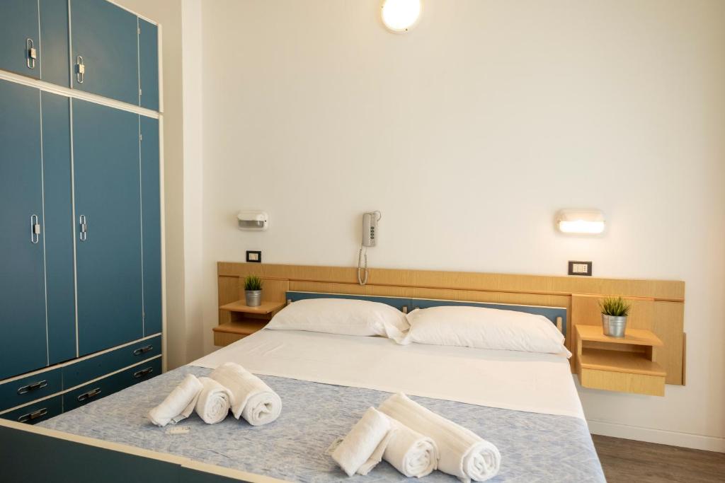 Postel nebo postele na pokoji v ubytování Hotel Lexington
