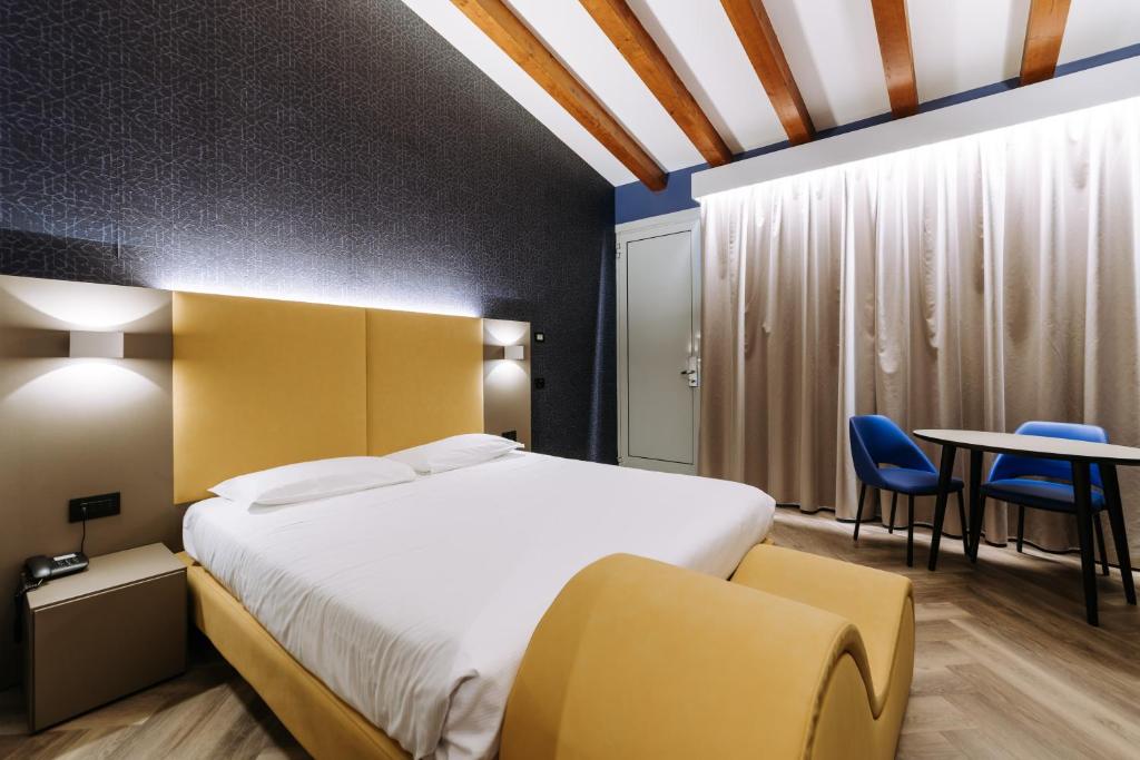 Postel nebo postele na pokoji v ubytování Hotel Motel Prestige