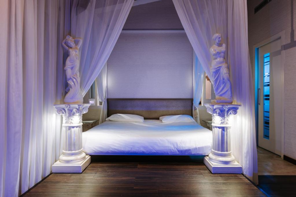 Postel nebo postele na pokoji v ubytování Hotel Motel Prestige