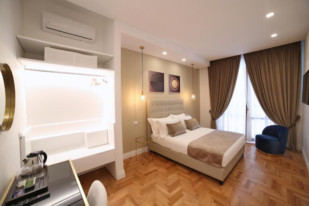 Łóżko lub łóżka w pokoju w obiekcie B&B Villa Sant'Elmo con parcheggio interno