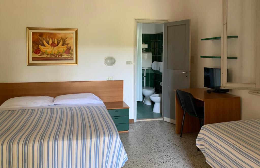 Postel nebo postele na pokoji v ubytování Hotel Garni Picnic
