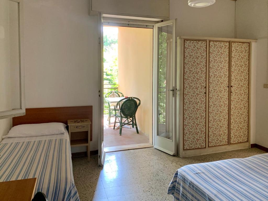 Postel nebo postele na pokoji v ubytování Hotel Garni Picnic
