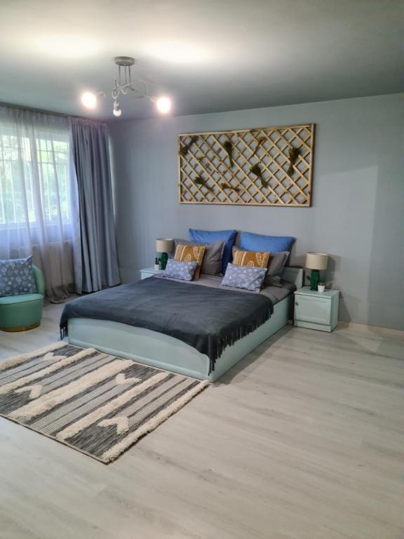 Postel nebo postele na pokoji v ubytování Zorilor Cactus Apartment