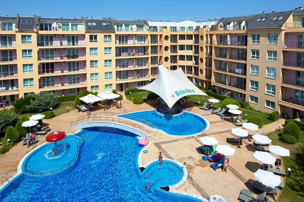 an aerial view of a swimming pool in front of a hotel at Pollo Resort in Sunny Beach