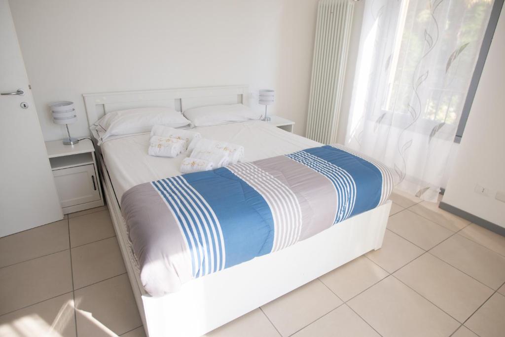 Postel nebo postele na pokoji v ubytování Griante suites