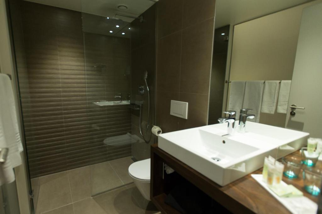 Koupelna v ubytování Hôtel des Voyageurs Boutique