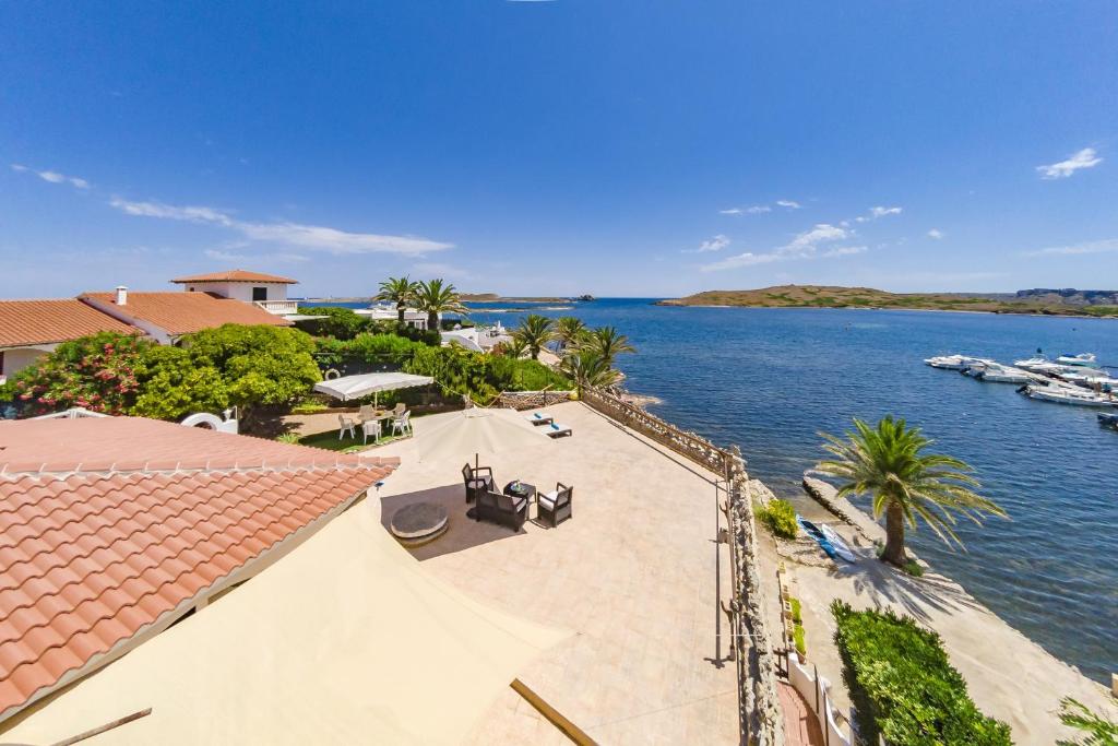 an aerial view of a house and the water at Villa Es Mirador de ses Altines in Na Macaret