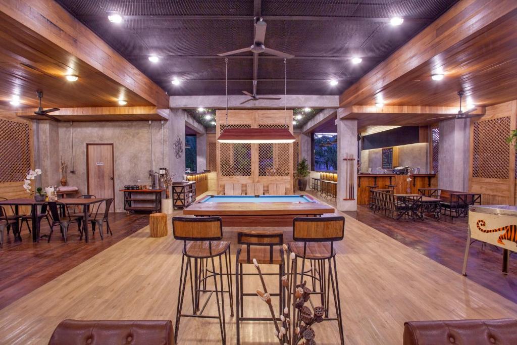 a large room with a ping pong table in it at The Chic Lipe in Ko Lipe