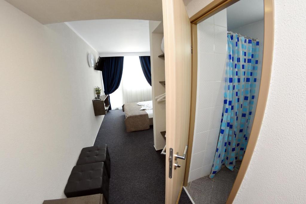 Postel nebo postele na pokoji v ubytování Hotel Victoria