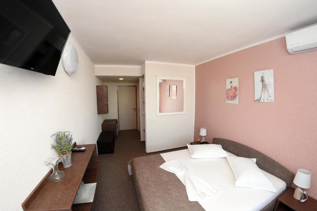 Postel nebo postele na pokoji v ubytování Hotel Victoria