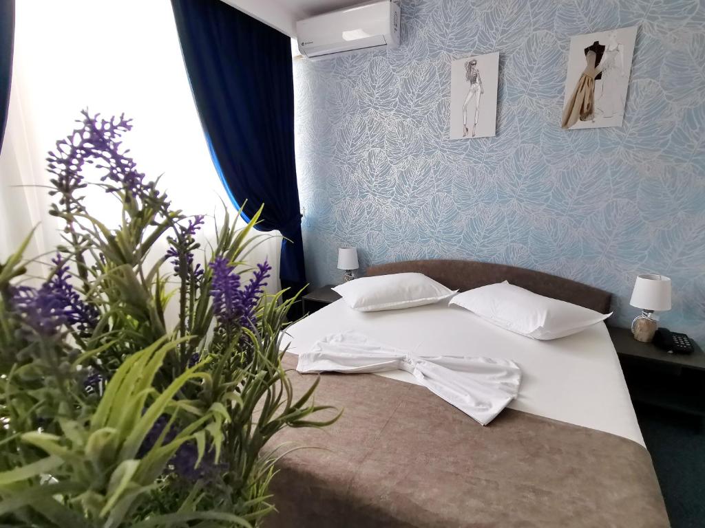 Postel nebo postele na pokoji v ubytování Hotel Victoria
