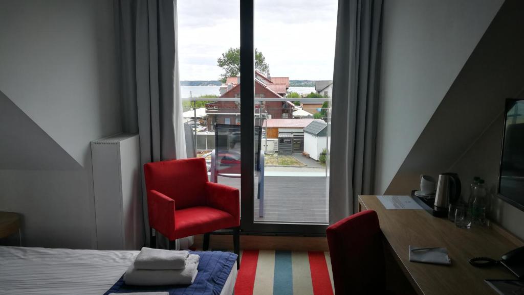 Postel nebo postele na pokoji v ubytování Hotel Skipper