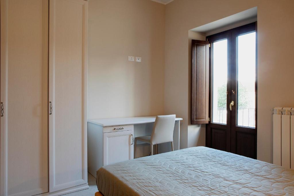 Posteľ alebo postele v izbe v ubytovaní Residenza Cappelli - Case Vacanze