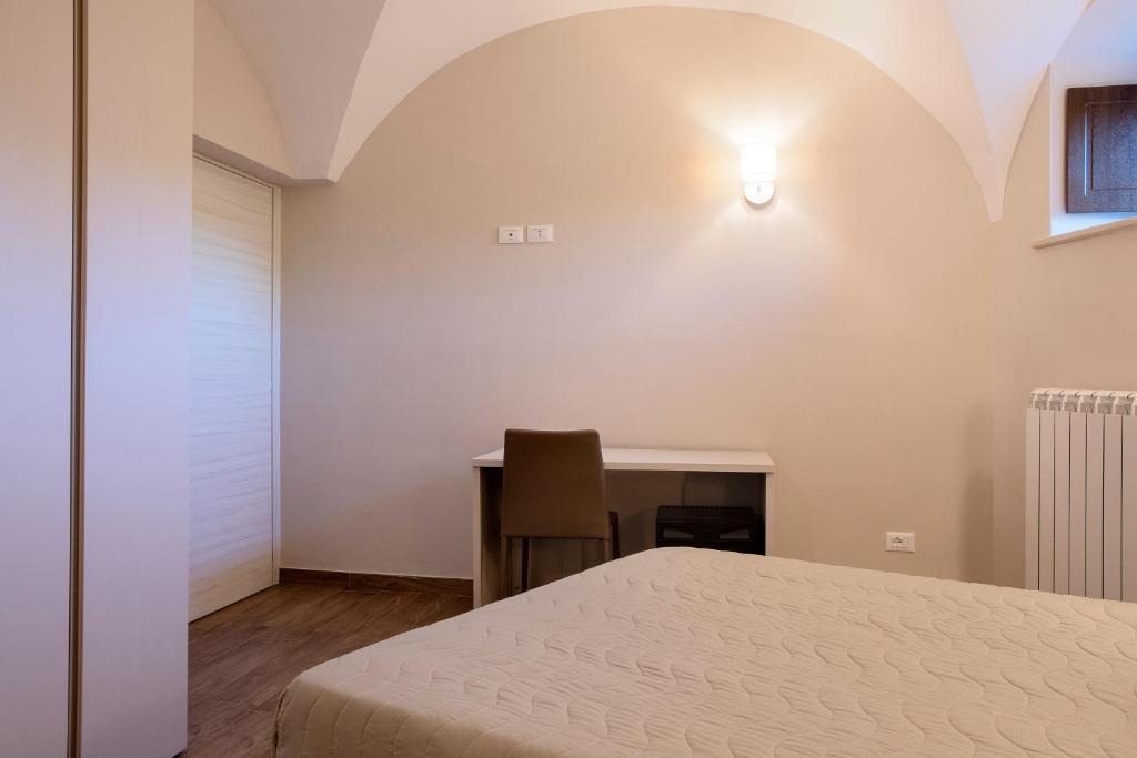 Posteľ alebo postele v izbe v ubytovaní Residenza Cappelli - Case Vacanze