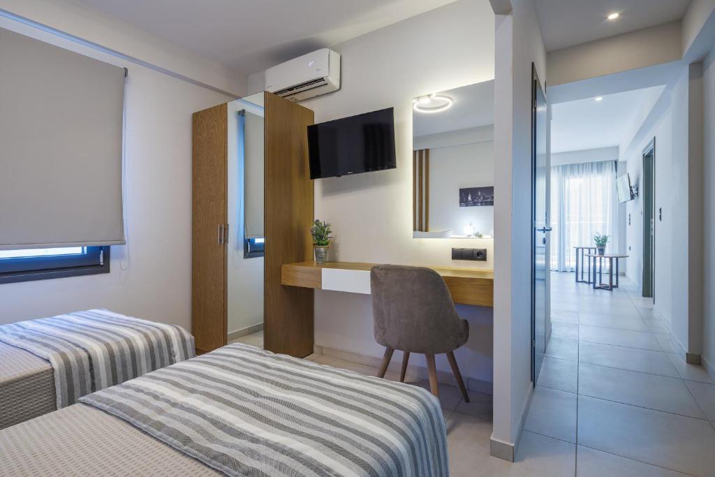 Postel nebo postele na pokoji v ubytování BISALTAE SEASIDE SUITES