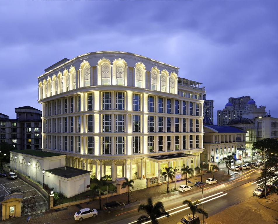 a large building on a city street at night at Meluha - The Fern in Mumbai