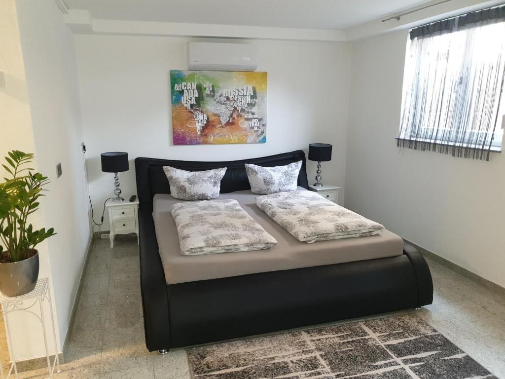 Postel nebo postele na pokoji v ubytování Rust-Fewo-Hotel