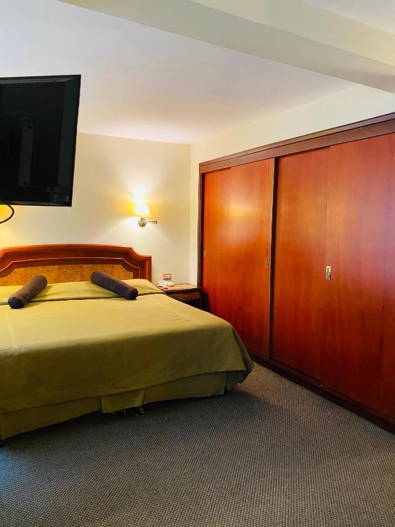 Postelja oz. postelje v sobi nastanitve Hotel Continental Lima