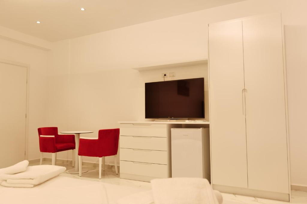 TV a/nebo společenská místnost v ubytování Lumi Hotel