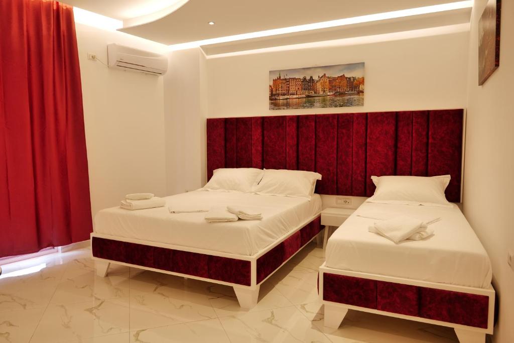 Postel nebo postele na pokoji v ubytování Lumi Hotel