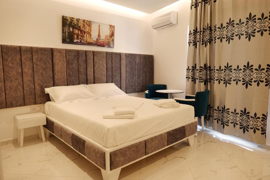 Postel nebo postele na pokoji v ubytování Lumi Hotel
