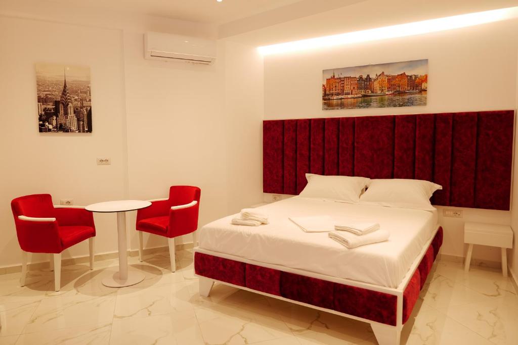 Postel nebo postele na pokoji v ubytování Lumi Hotel