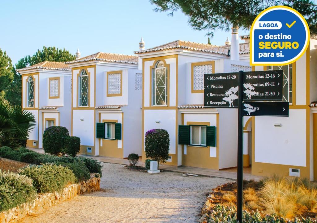 a building with a sign in front of it at Vale d'El Rei Hotel & Villas in Carvoeiro