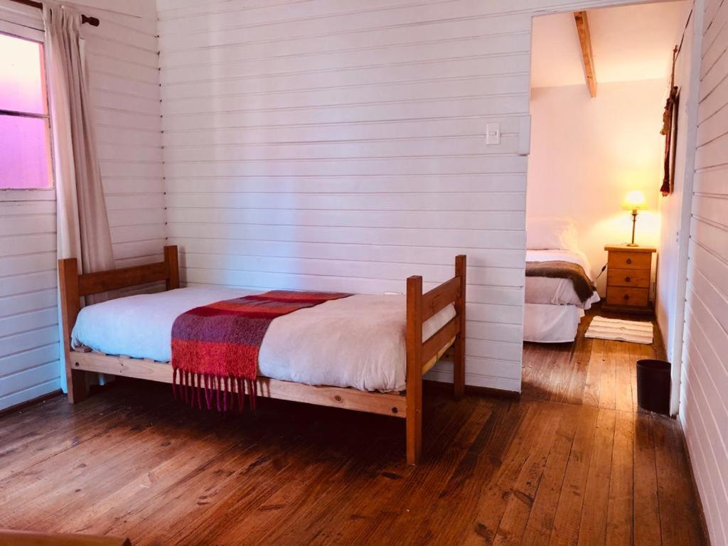 Postel nebo postele na pokoji v ubytování El Arbol Hostel