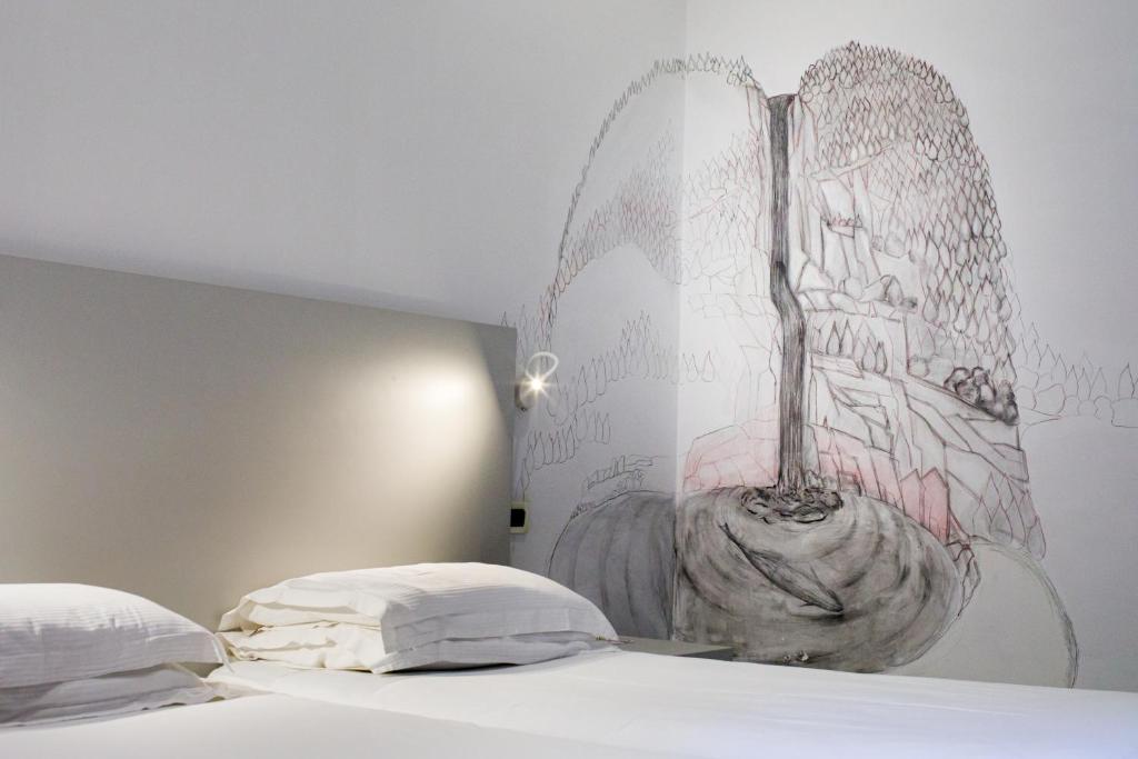 Postel nebo postele na pokoji v ubytování Art Hotel Gran Paradiso