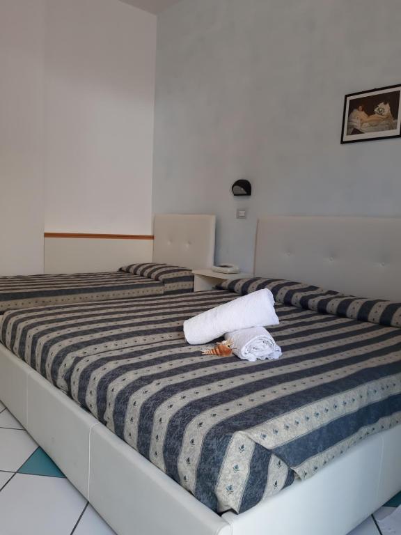 Postel nebo postele na pokoji v ubytování Hotel Poker