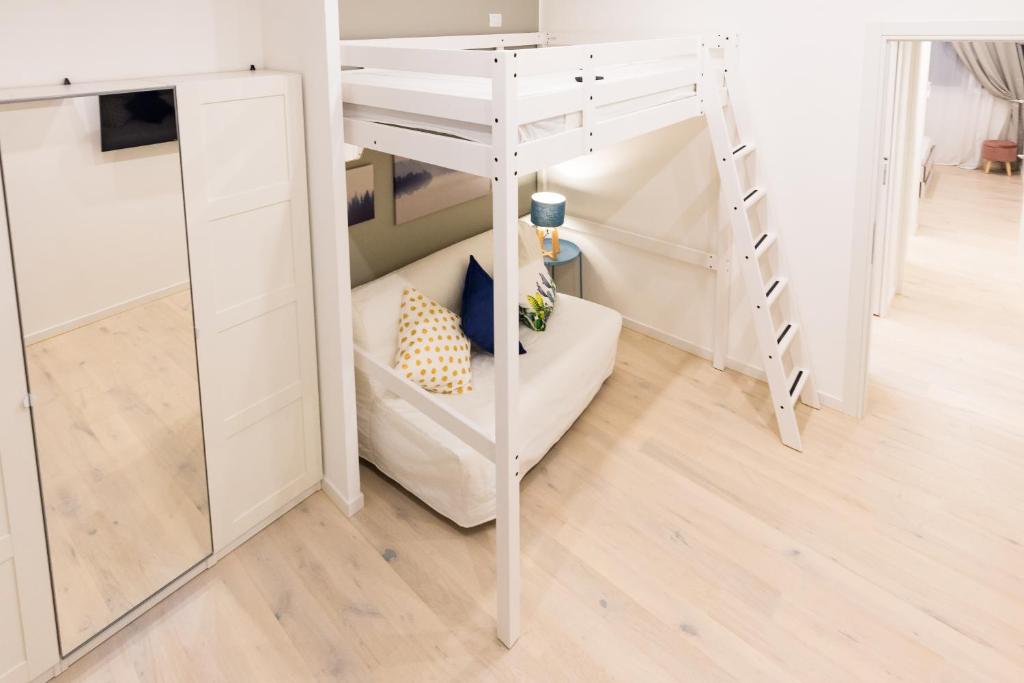 A bed or beds in a room at Apartment Greppi 5