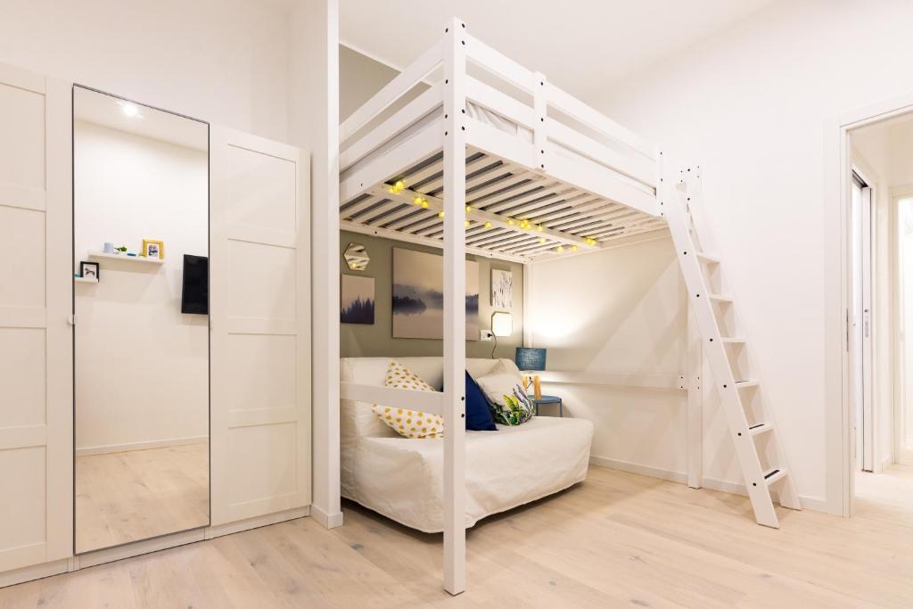 A bed or beds in a room at Apartment Greppi 5