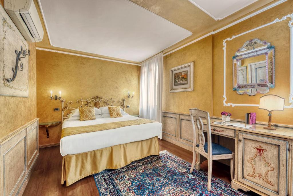 Postel nebo postele na pokoji v ubytování Hotel Al Piave