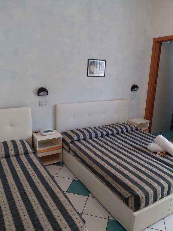 Postel nebo postele na pokoji v ubytování Hotel Poker