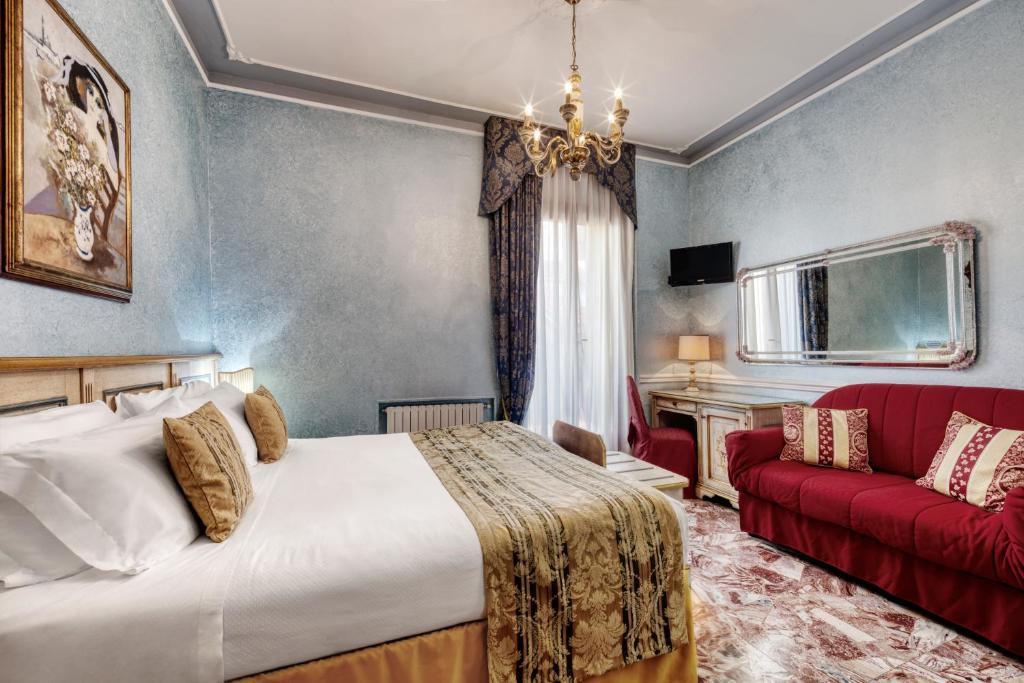 Postel nebo postele na pokoji v ubytování Hotel Al Piave