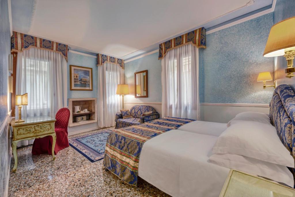 Postel nebo postele na pokoji v ubytování Hotel Al Piave