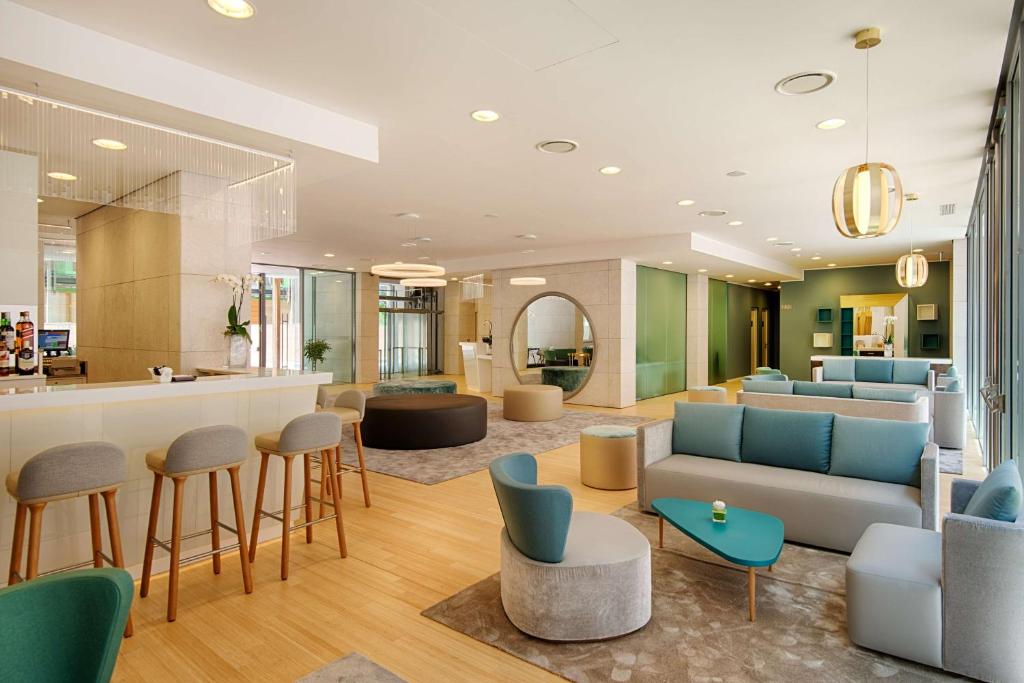 A seating area at NH Trento