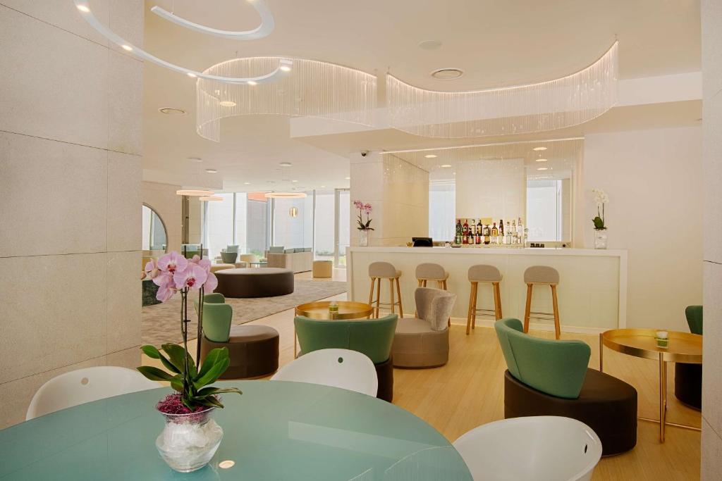 A seating area at NH Trento