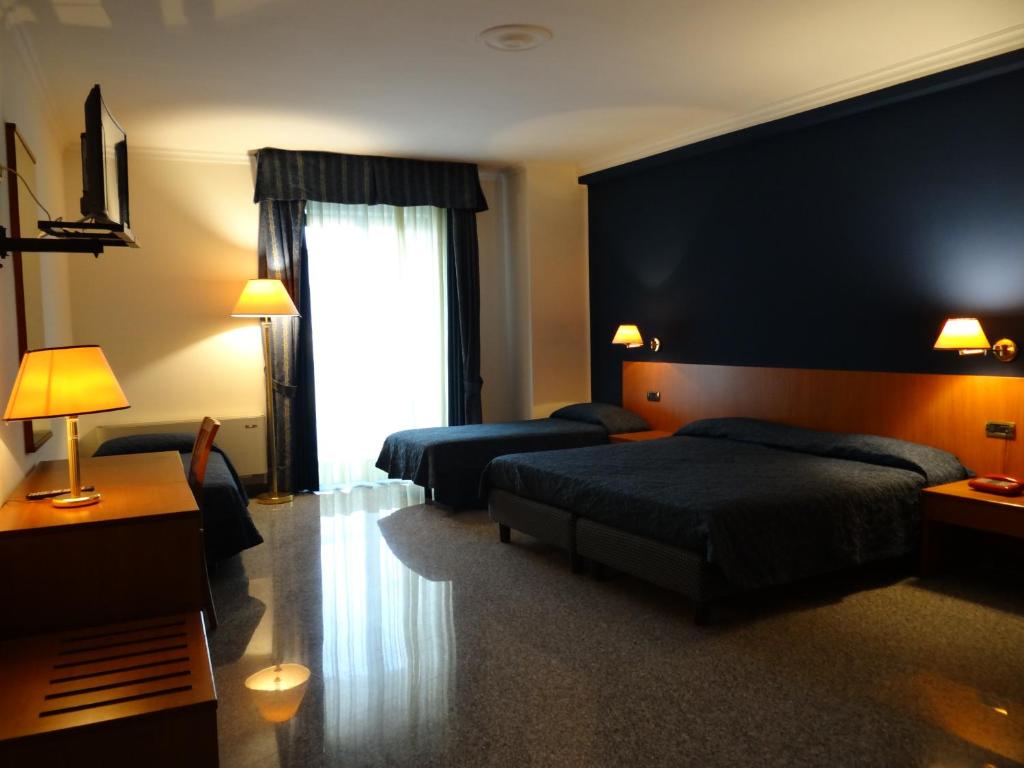Posteľ alebo postele v izbe v ubytovaní Hotel 90