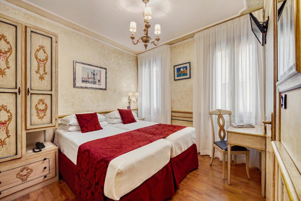 Postel nebo postele na pokoji v ubytování Hotel Al Piave