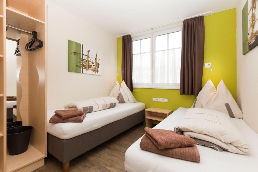 Postel nebo postele na pokoji v ubytování Rutsche Hostel