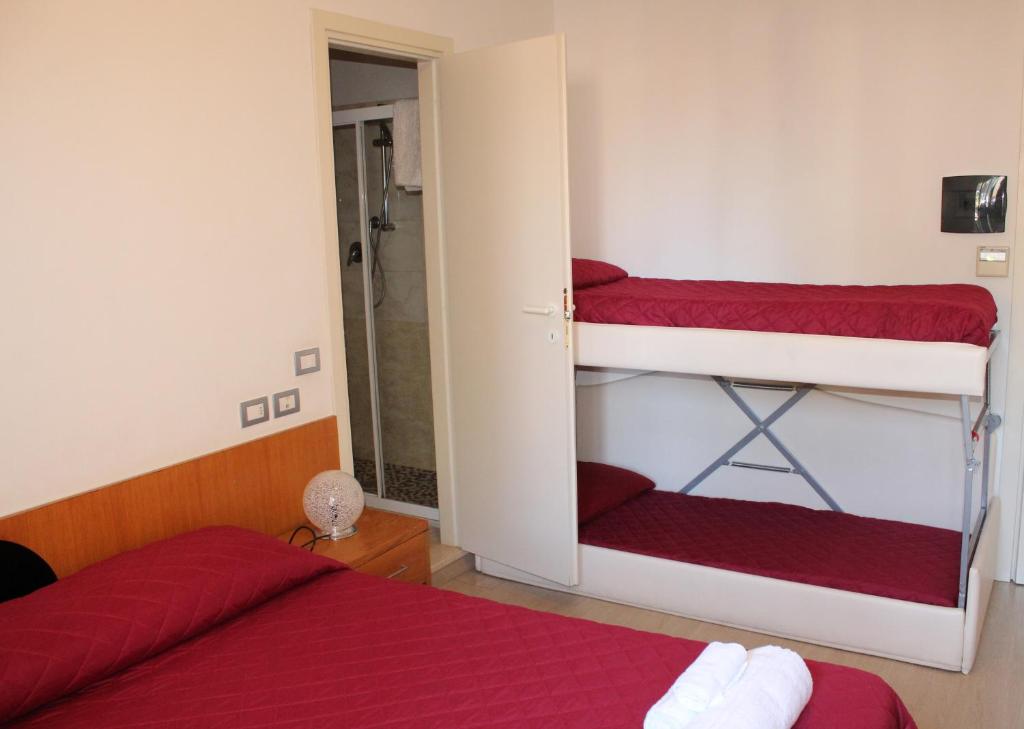 Postel nebo postele na pokoji v ubytování Hotel Morolli