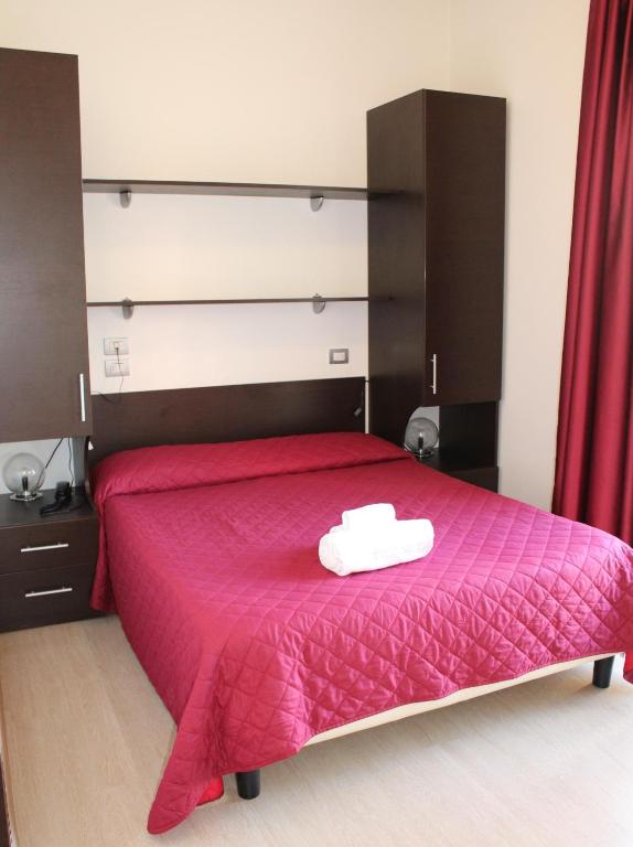 Postel nebo postele na pokoji v ubytování Hotel Morolli