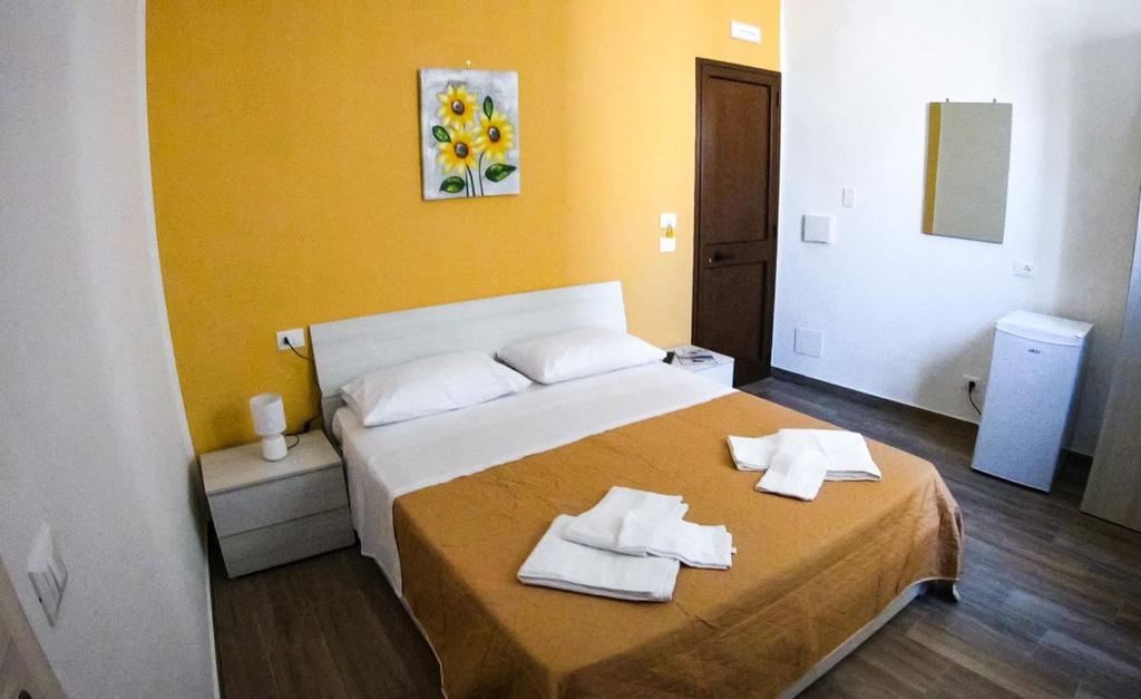 A bed or beds in a room at La casa dei Fiori